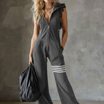Retro športni jumpsuit Alma Ljubljana Renata, udoben in moderen, prikazan na modelu s športnim videzom.