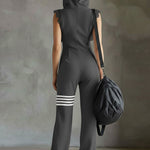 Renata retro športni jumpsuit Alma Ljubljana, modro-belega dizajna, primeren za prosti čas in aktivne dejavnosti.