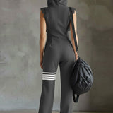 Renata retro športni jumpsuit Alma Ljubljana, modro-belega dizajna, primeren za prosti čas in aktivne dejavnosti.