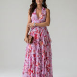 Maxi obleka Alma Ljubljana Nori s rožnatim vzorcem in halter ovratnikom, elegantna in udobna za posebne priložnosti.