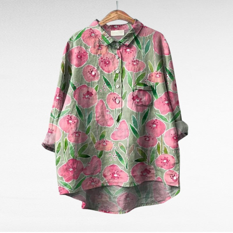 Elegantna vintage bluzon Mireva Alma Ljubljana, modno oblikovana s detajli, prikazan na sliki.