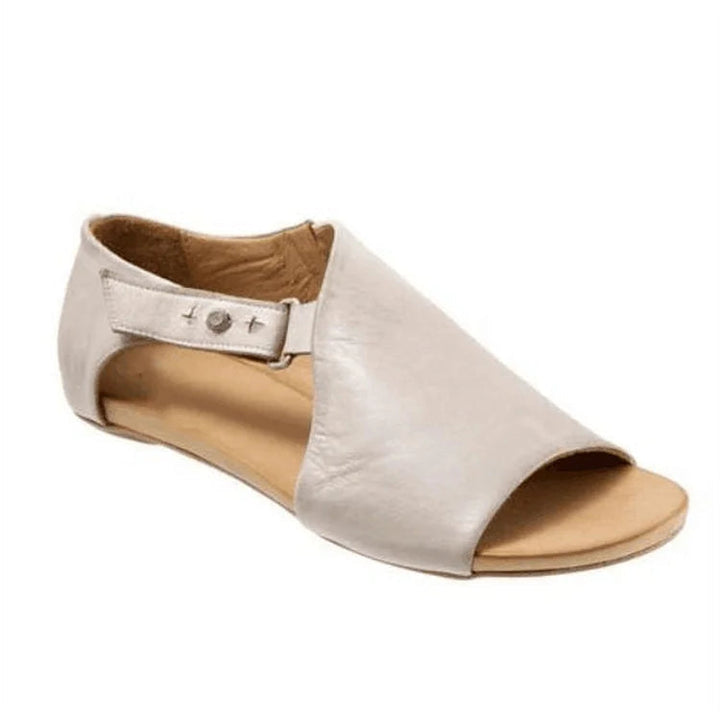 Asimetrični sandali cut-out peep toe v enotni barvi z naramnicami in sponko