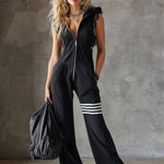 Renata retro športni jumpsuit Alma Ljubljana, modro-zelene barve, s športnim krojem in elegantnim retro pridihom.