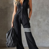 Retro športni jumpsuit Alma Ljubljana Renata, modno oblikovan športni overall z dodelanimi podrobnostmi, prikazan na sliki