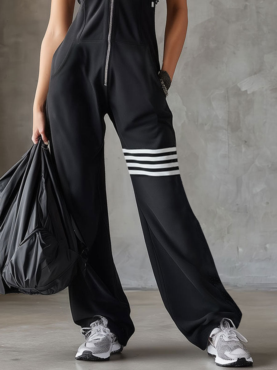 Retro športni jumpsuit Alma Ljubljana Renata, modro-črni športni kombinezon z vintage stilom, prikazan na sliki.