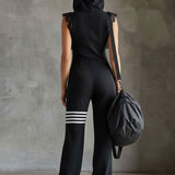 Retro športni jumpsuit Alma Ljubljana Renata, široke nogavice in elastičen pas, v svetlo modri barvi
