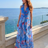 Maxi obleka Alma Ljubljana Nori s rožnatim vzorcem in halter ovratnikom, elegantna in sproščena ženska obleka.