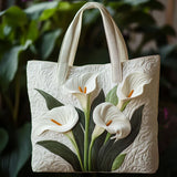 Bela ročna torba Sac Artisanal Matelassé Coquillage Alma Ljubljana, mehka in elegantna s teksturiranim vzorcem, prikazana na sliki.