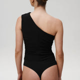 Črna Flair bodysuit Mila Ljubljana, prilegajoča se ženska oblačila z dolgimi rokavi in izrezom na hrbtu.