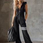 Renata retro športni jumpsuit Alma Ljubljana, modro-črni športni kombinezon z elegantnim retro dizajnom.