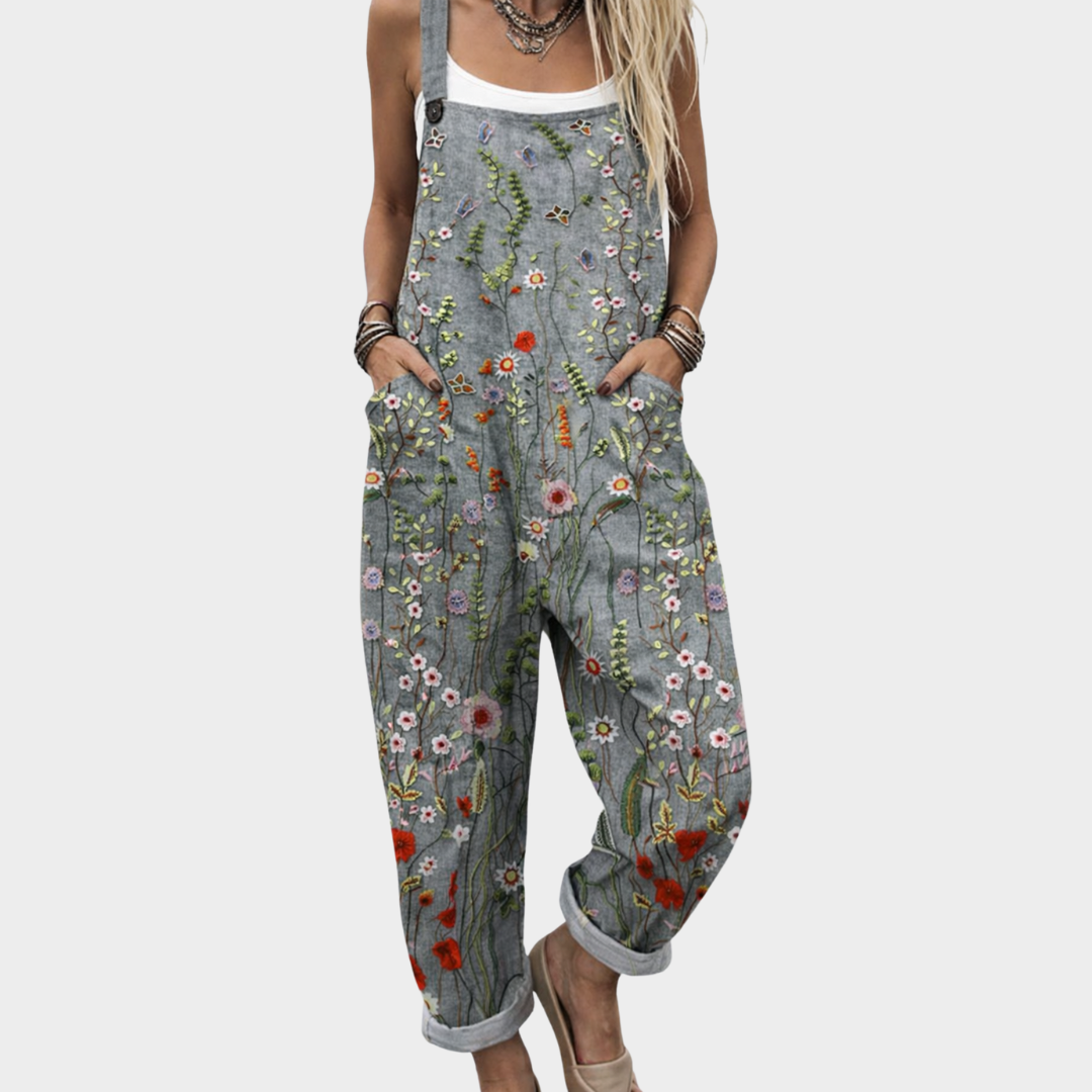 Udobna potiskana jumpsuit Alma Ljubljana, prikazan na sliki s sproščenim krojem in barvnimi vzorci.