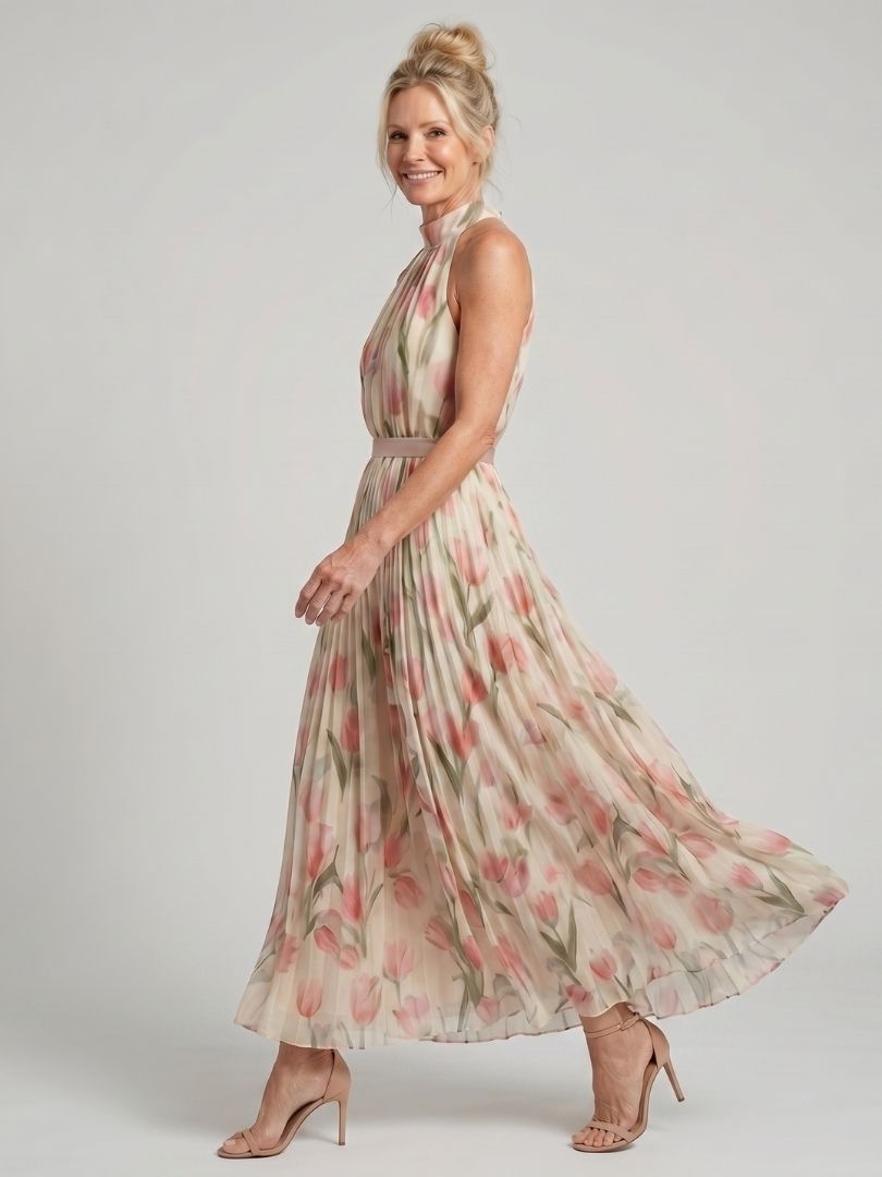 Aurelle midi obleka z cvetličnim vzorcem in naramnicami, Alma Ljubljana, na modeli, elegantno in sproščeno.
