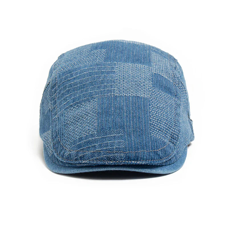 Modra denim moška kapa Alma Ljubljana, trpežna in slogovna, prikazana na sliki.