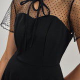 Črna prosojna mini obleka Mila Ljubljana, ženska, knit polyester, midi dolžina, elegantno in modno oblačilo.