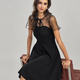 Črna prosojna mini obleka Mila Ljubljana, ženska, pletena, polyester, midi dolžina, elegantno in modno.